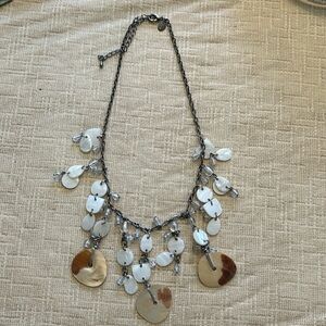Chico’s beaded necklace
Hanging shelllike and clear beads